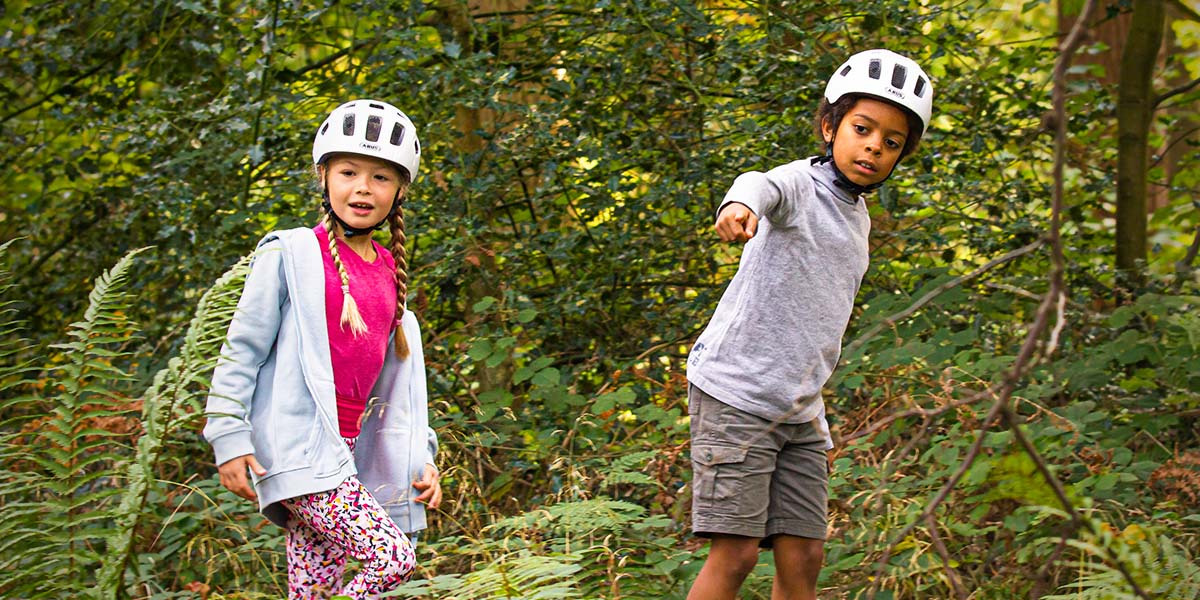 Kid holding balance bike handlebar