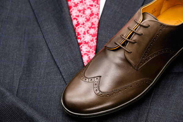 brown brogue dress shoe sneaker with grey suit