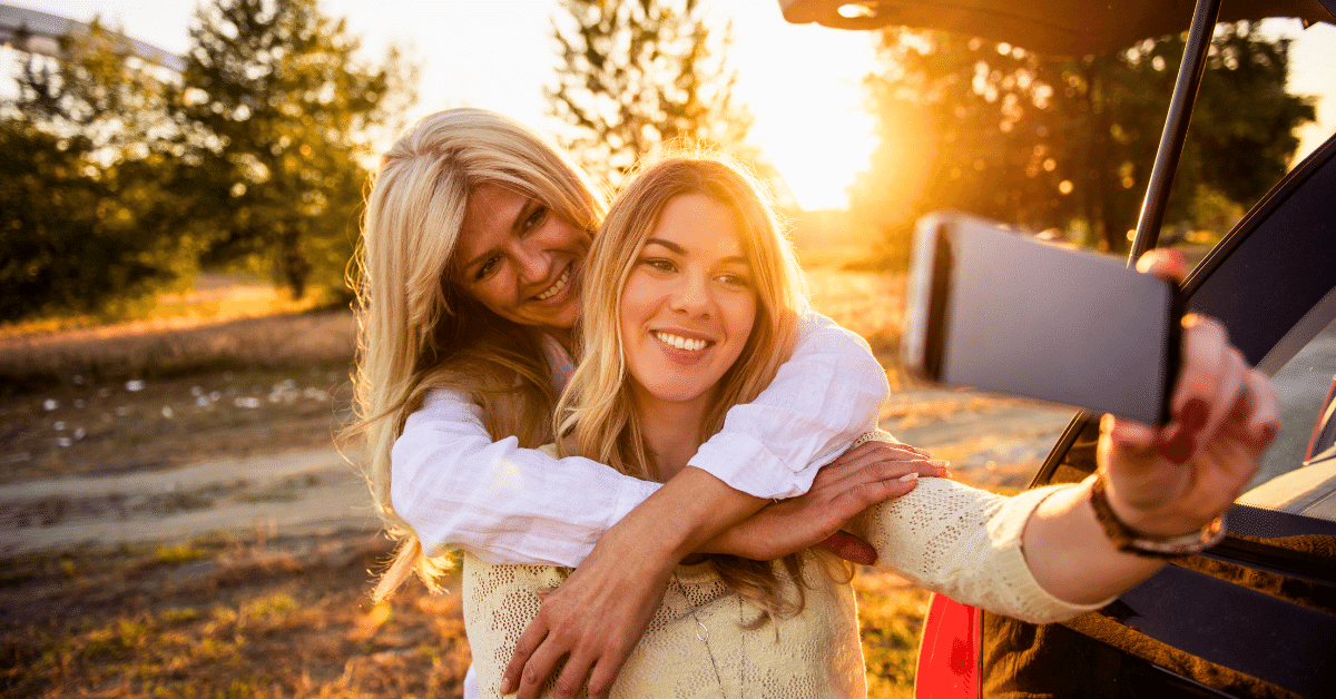 A photo of a mother and daughter together, hugging or laughing, to illustrate the special bond between a mother and her child.