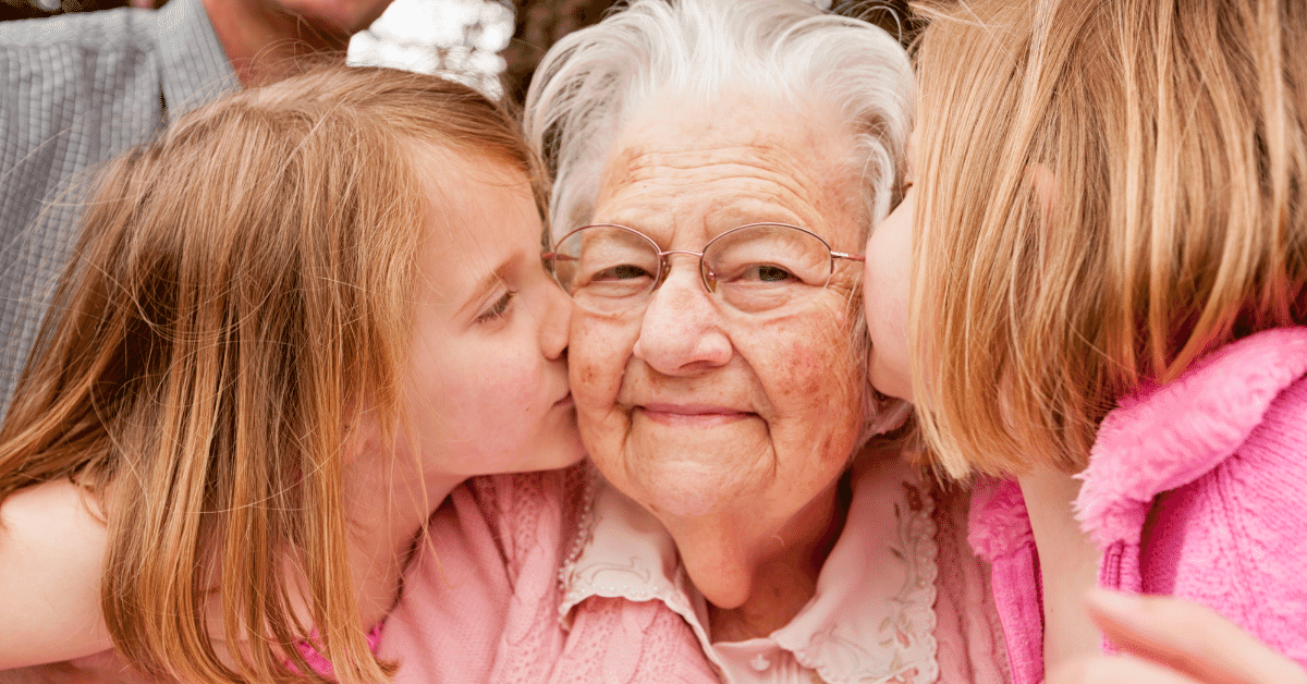 A photo of a grandma and daughter together, hugging or laughing, to illustrate the special bond between a grandmother and her child.