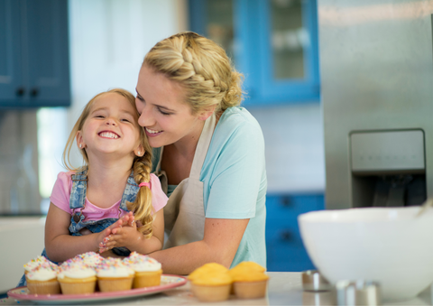 Mum and daughter baking together