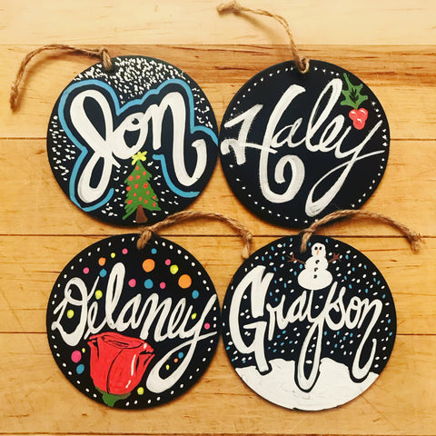 Christmas ornaments with peoples names in chalk marker