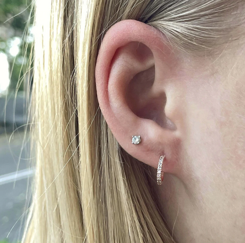 womans-double-pierced-ear-close-up-with-diamond-gold-hoop-earring–and-diamond-stud-earring