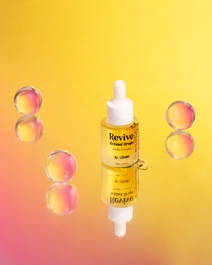 the natural retinol serum next to orange bubbles