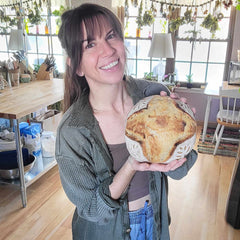 Stephanie holding a stunning sourdough loaf made in the RackMaster RM2020