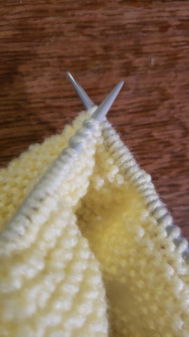 Light yellow project on knittng needles
