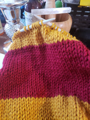 Scarf on knitting needles