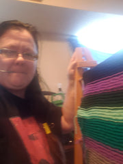 The Crazy Knitter with a crochet in her mouth standing beside the special custom order