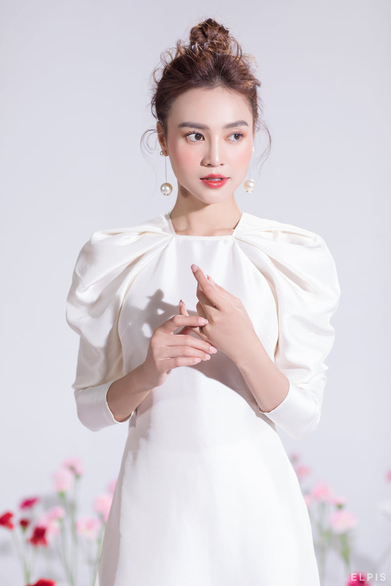 Ao dai featuring raglan crescent sleeves, round neckline | Cat Tuong ...