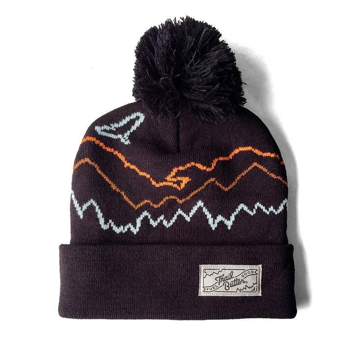 https://cdn.shopify.com/s/files/1/0406/6194/2428/products/TB_Territory_Trailscape_Beanie_Pom_Black_720x.jpg?v=1664369318