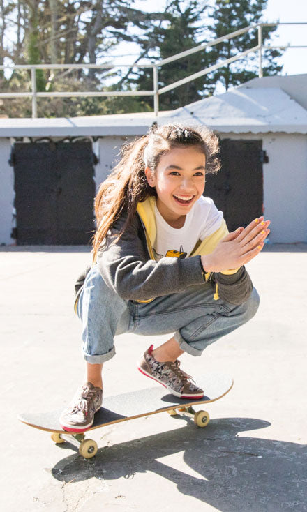 Girl riding skateboard wearing Prospect style shoes