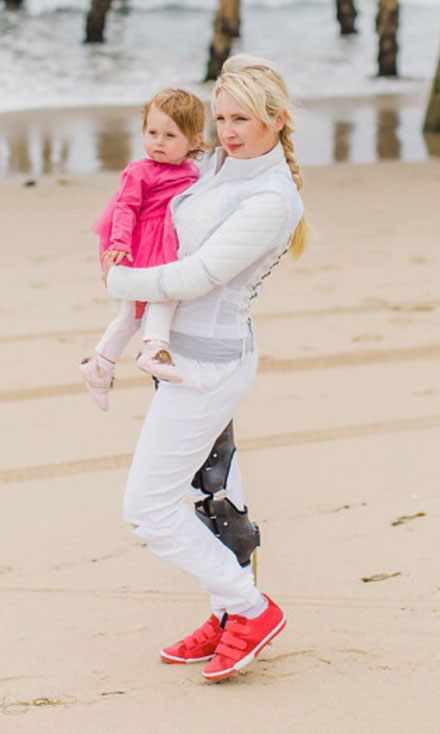 Woman holding child wearing Larkin style shoes