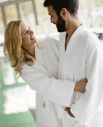 Couple in hotel robes at the spa
