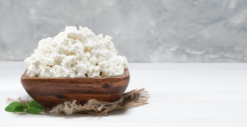 cottage-cheese-traditional-wooden-bowl-white-wooden-background-close-up-selective-focus-with-copy-space-soft-curd-natural-healthy-food-wholesome-diet-food.jpg__PID:c728799e-78fc-4511-9852-3d67324fd41e