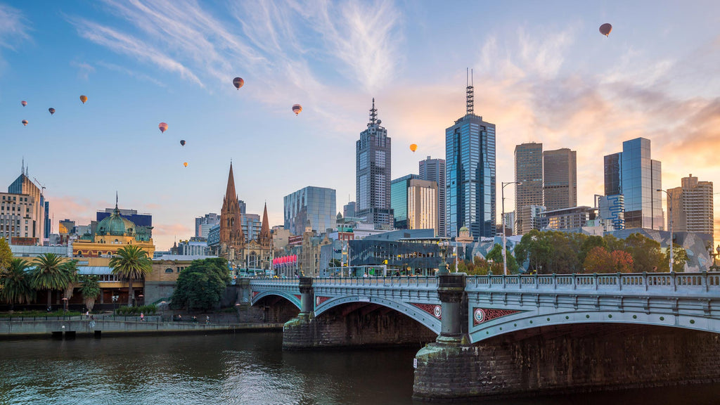 Melbourne City At Twilight Overlooking Yarra River With Hot Air Balloons