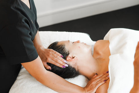 Woman Receiving Upper Body Massage At Botanica