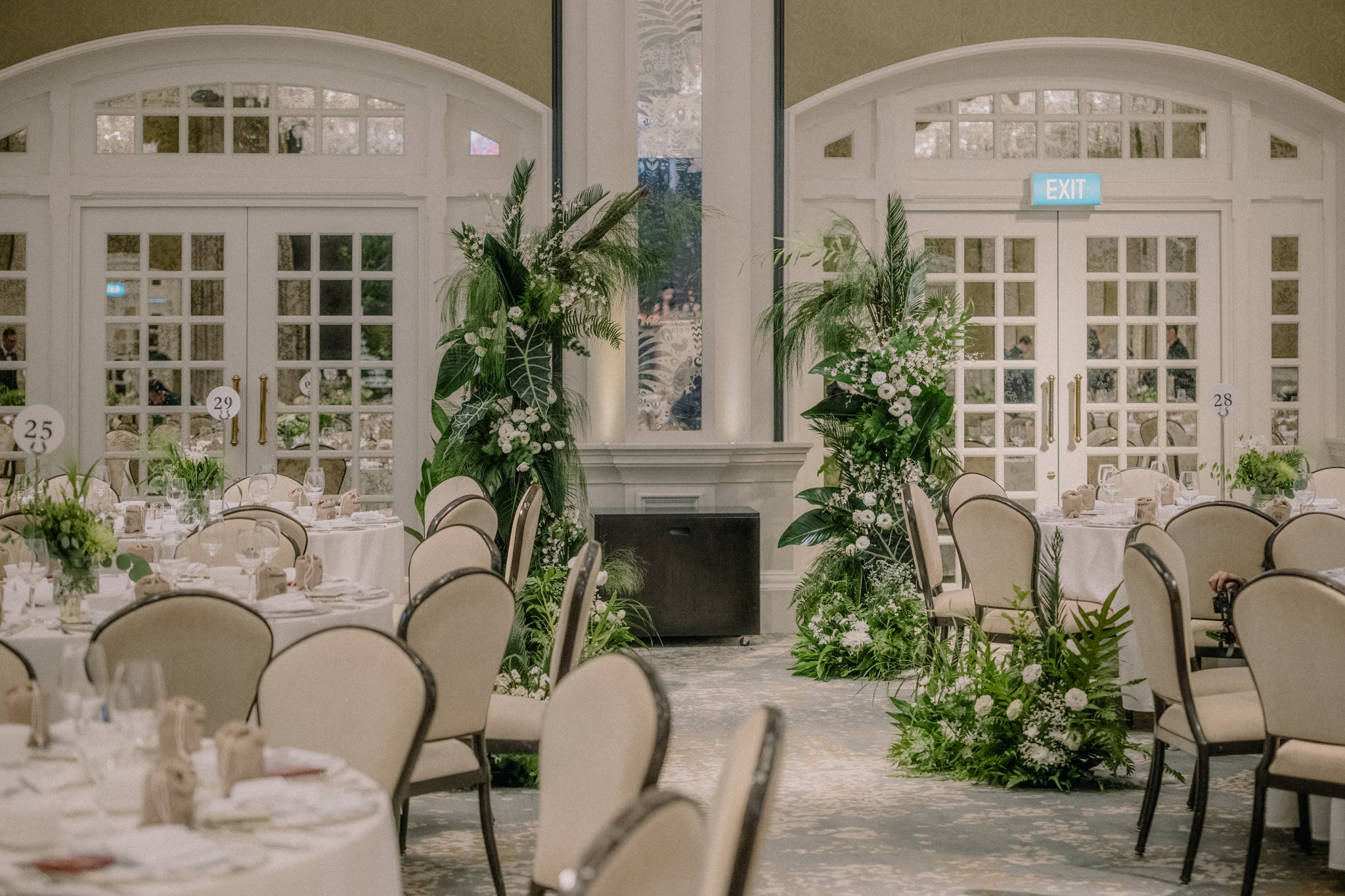 botanical tropical aisle arrangement for green wedding lunch reception at raffles hotel singapore 16