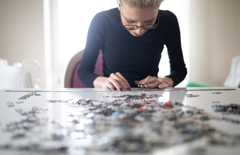 woman-doing-a-jigsaw-puzzle