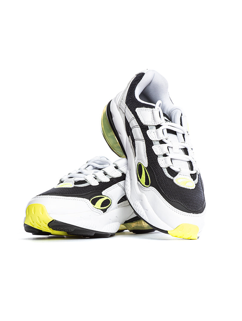 yellow black and white sneakers