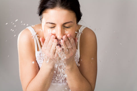 Wash your face twice daily to help reduce flakes