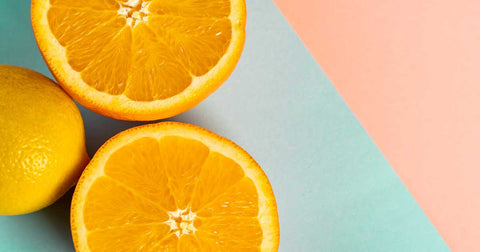 Orange slices on a blue and pink background