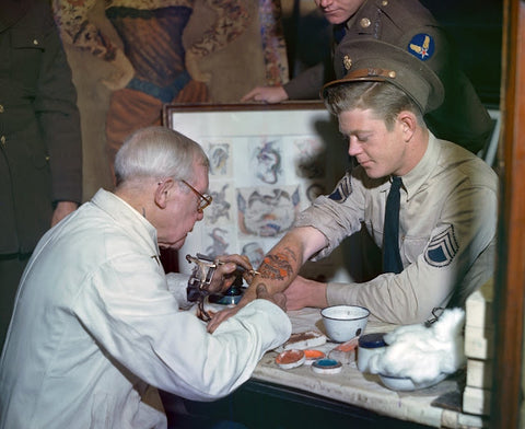 George Burchett tattooing a soldier during World War II