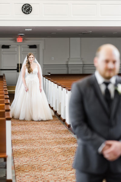 David's first look of Leah in her wedding dress