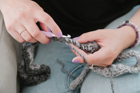 two hands crocheting