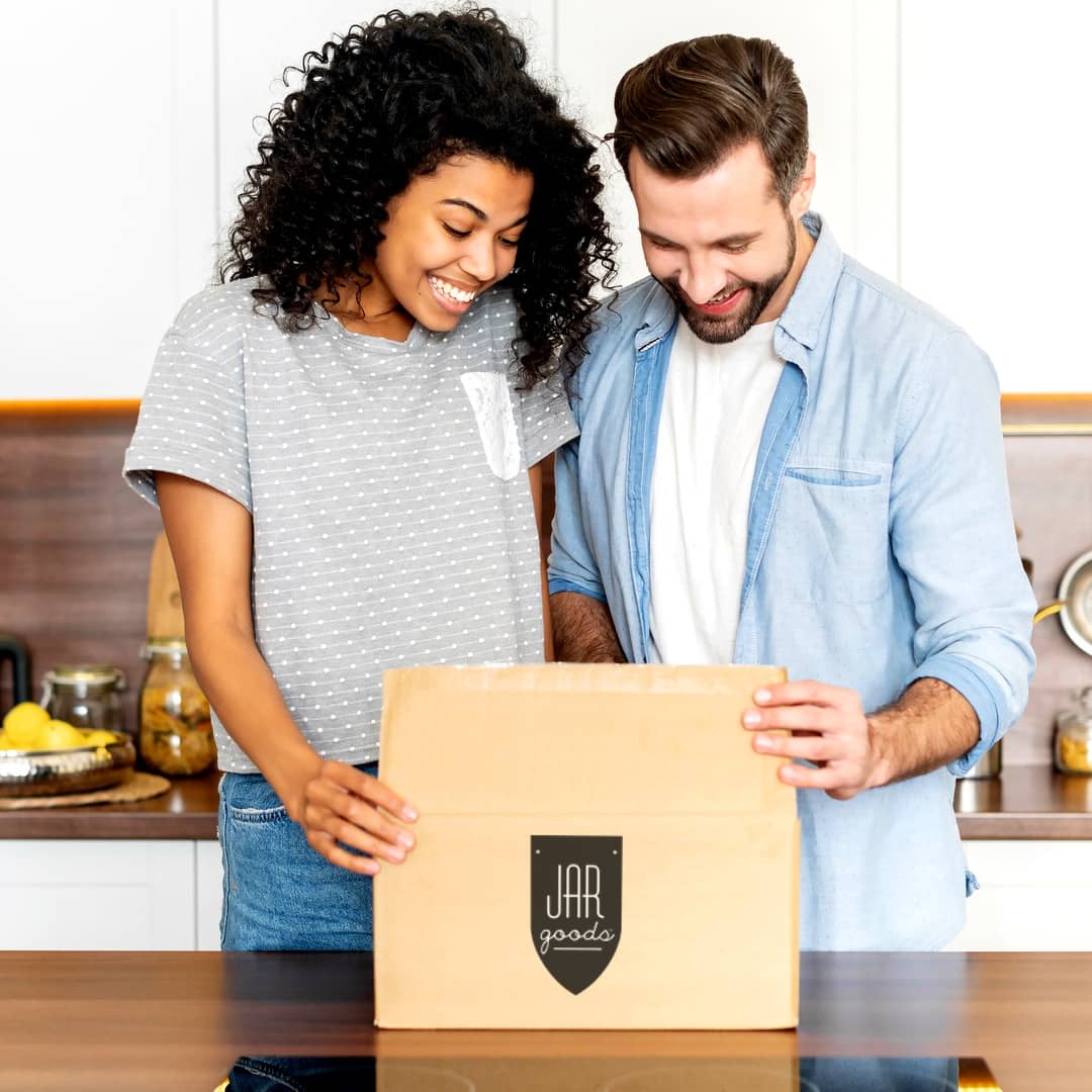 Couple opening a Jar Goods variety pack housewarming gift