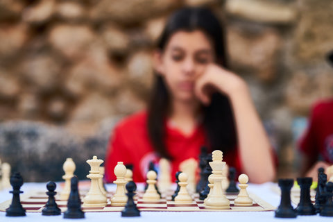 decision making girl playing chess