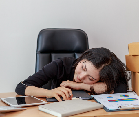 woman falling asleep at desk narcolepsy