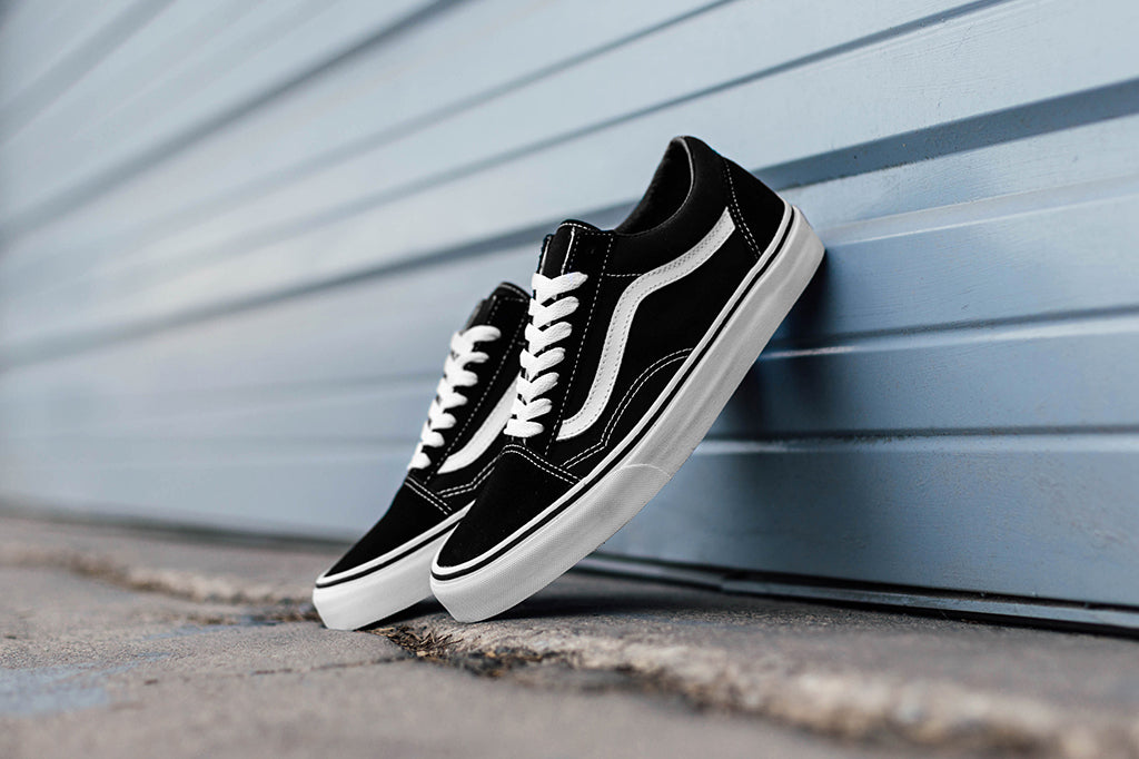 black vans with white stitching