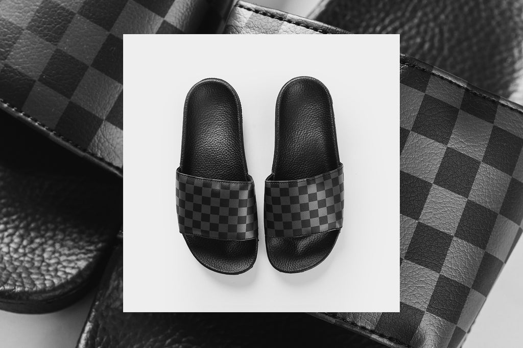 vans black checkerboard slides