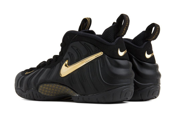 black and metallic gold foamposite pro