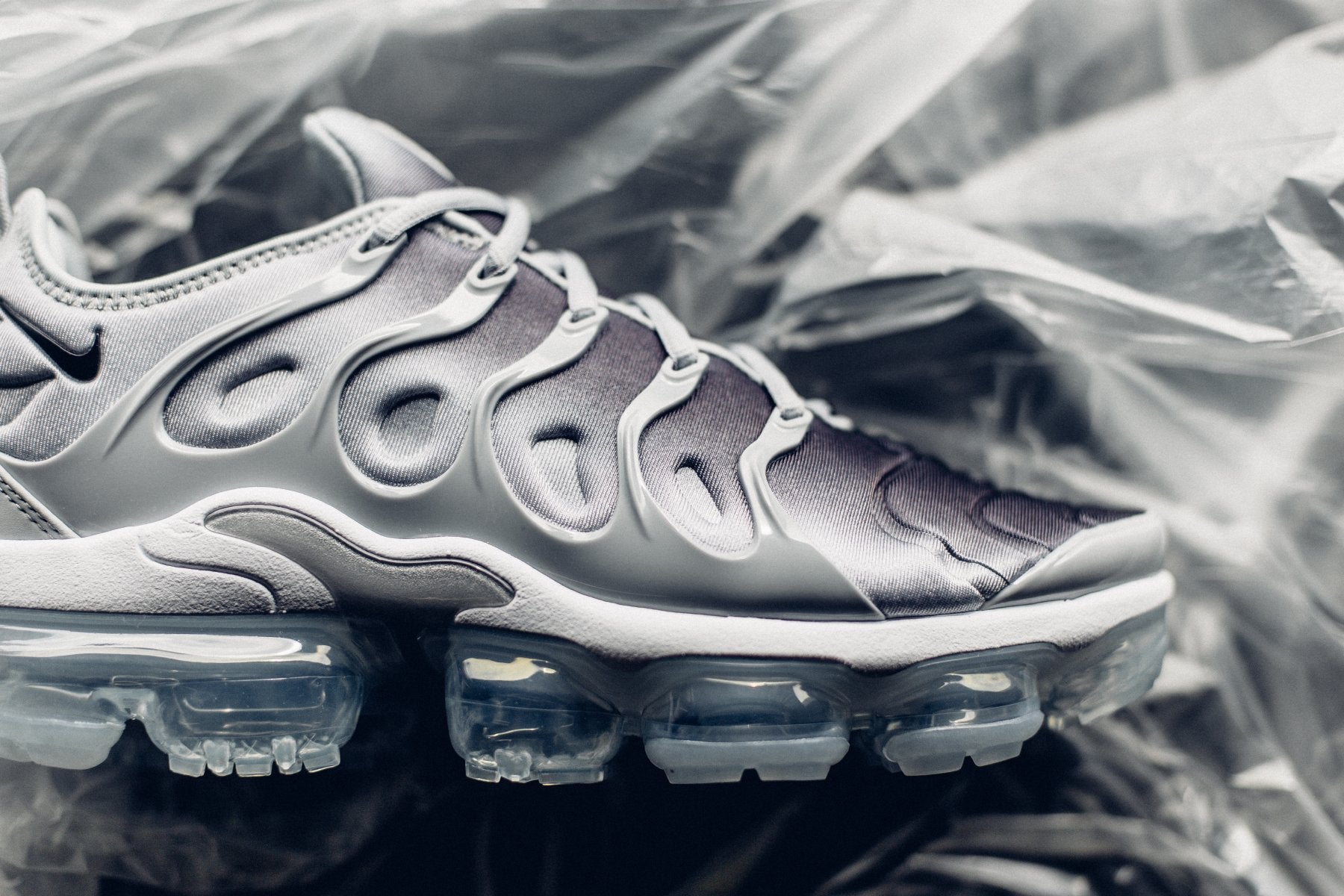 grey and white vapormax plus