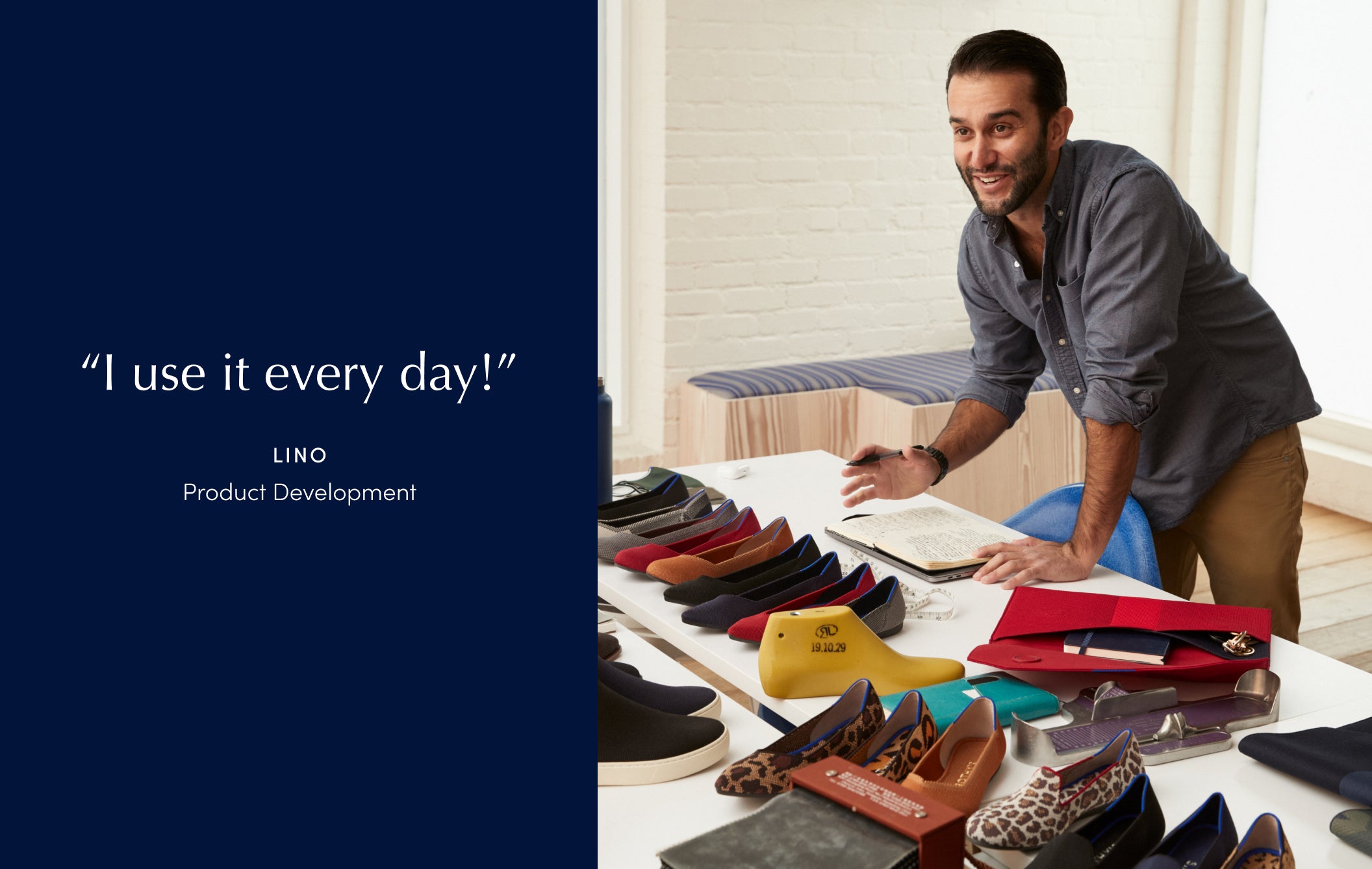 A man standing over his notebook at a white table, with an assortment of shoes and materials in front of him. 