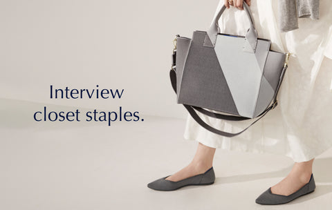 Text saying "Interview Closet Staples", against a background image of a model holding The Handbag in Charcoal Grey. 