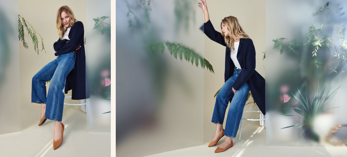 Two views of a model sitting on a stool wearing The Point in Fawn, against a translucent screen background with plants. 