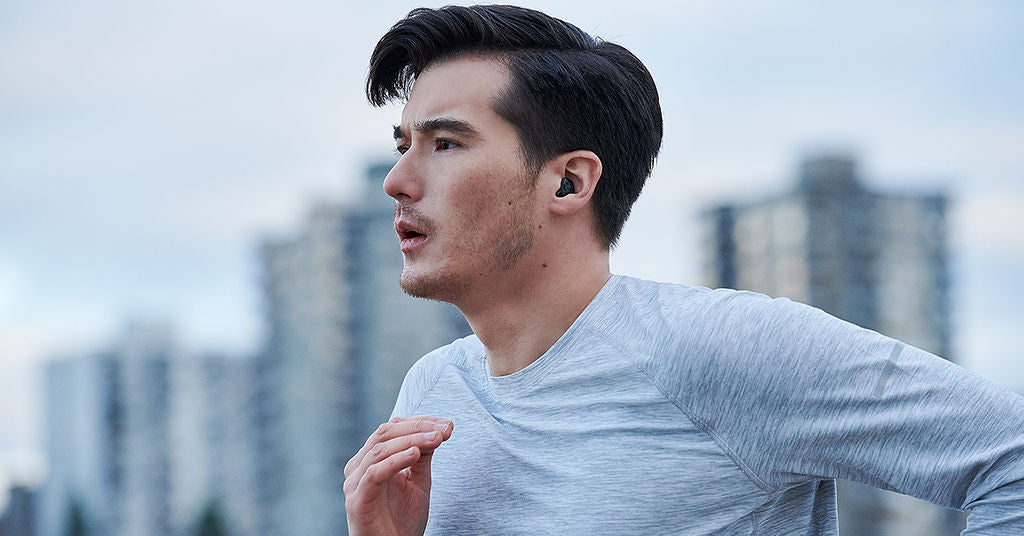 Person running with hearing aids.