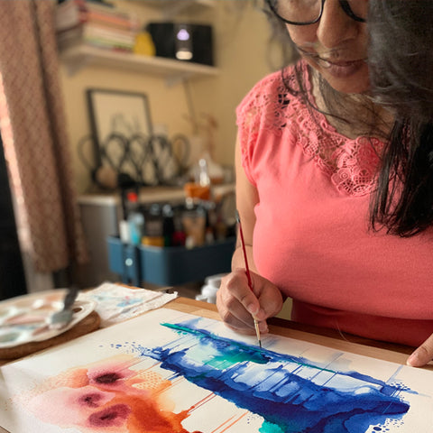 Ishita painting with a paintbrush