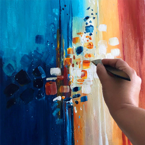 Artist using tools on an abstract canvas