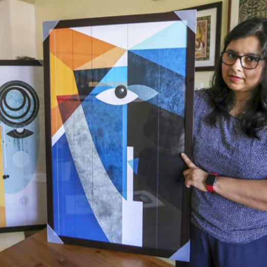 Ishita standing next to abstract art