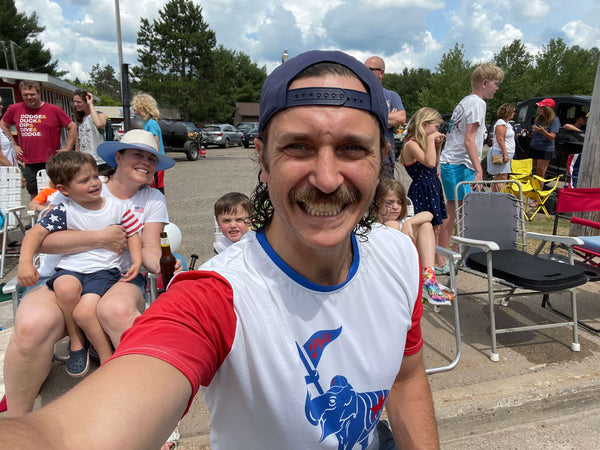 man with a mustache wearing an old school Philadelphia Athletics Phillies shirt from Phillygoat