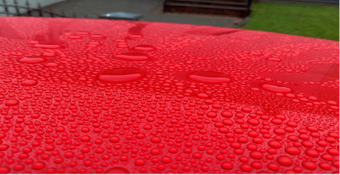 Water beading on red car. hydrophic sealant and coating. Autoglym Ireland, Autoglym Cork Ireland