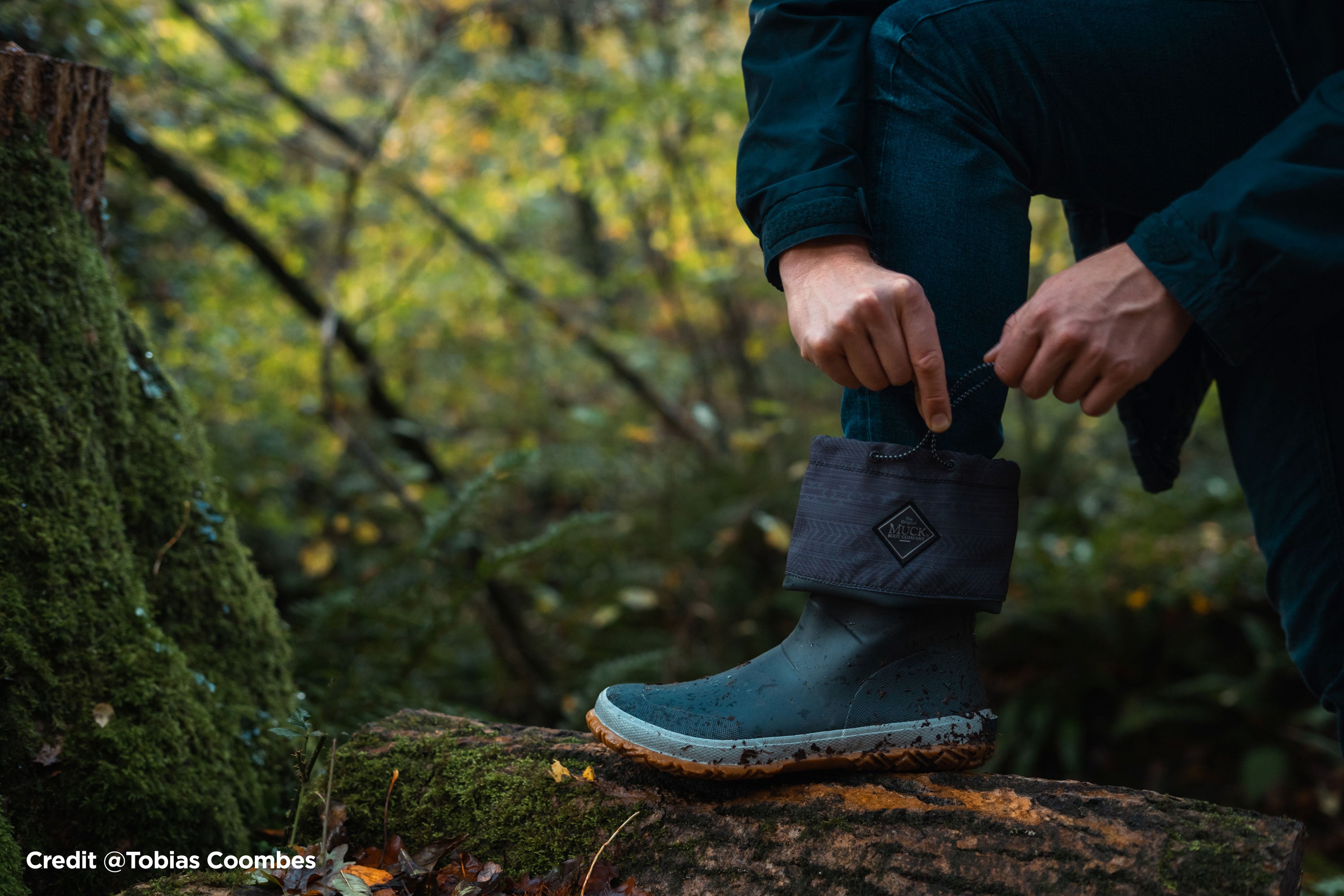 Person fastening a Muck Boot Forager. Image credit - Tobias Coombes