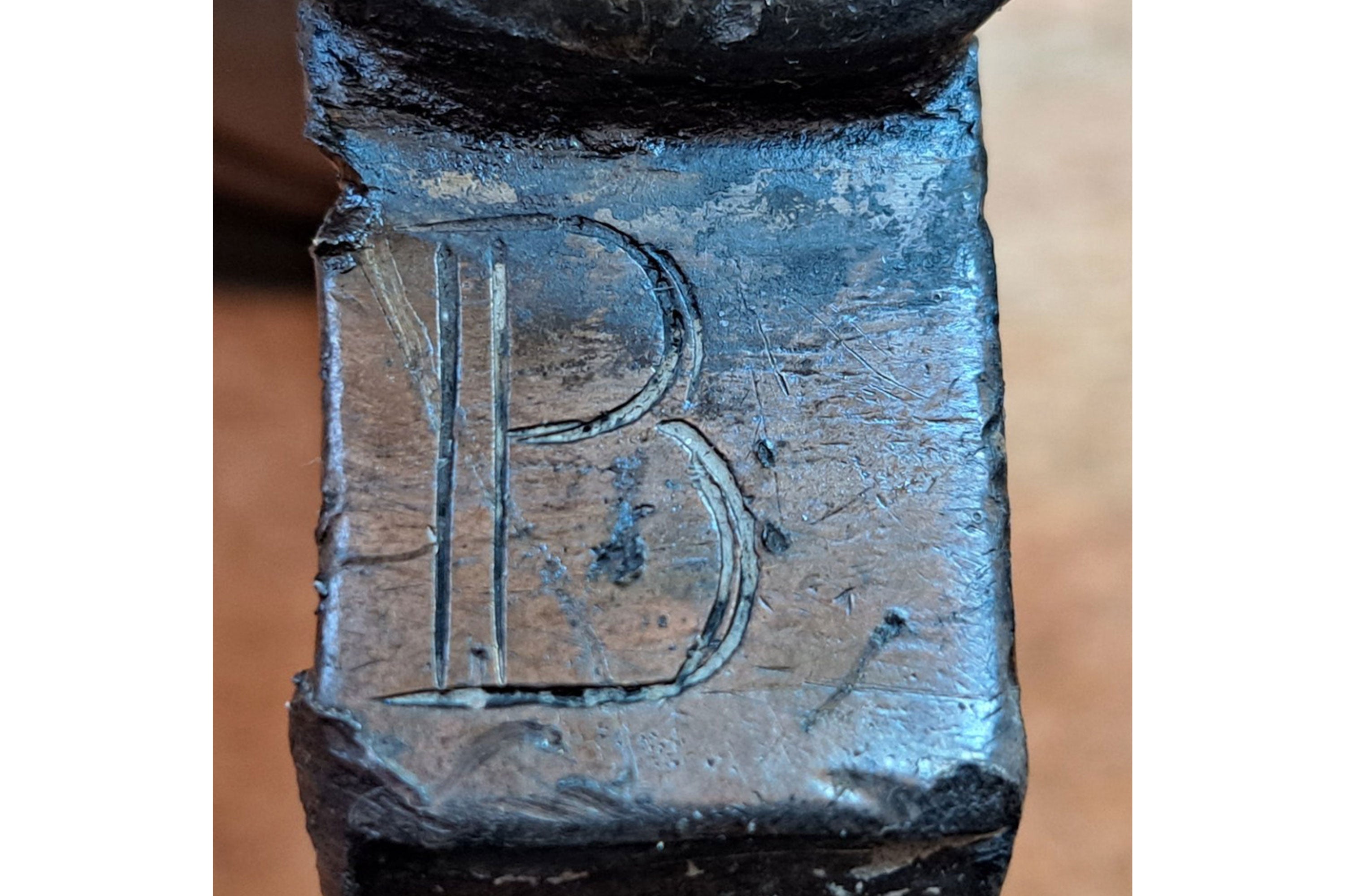 Letter B engraved on a metal pewter tavern mug handle