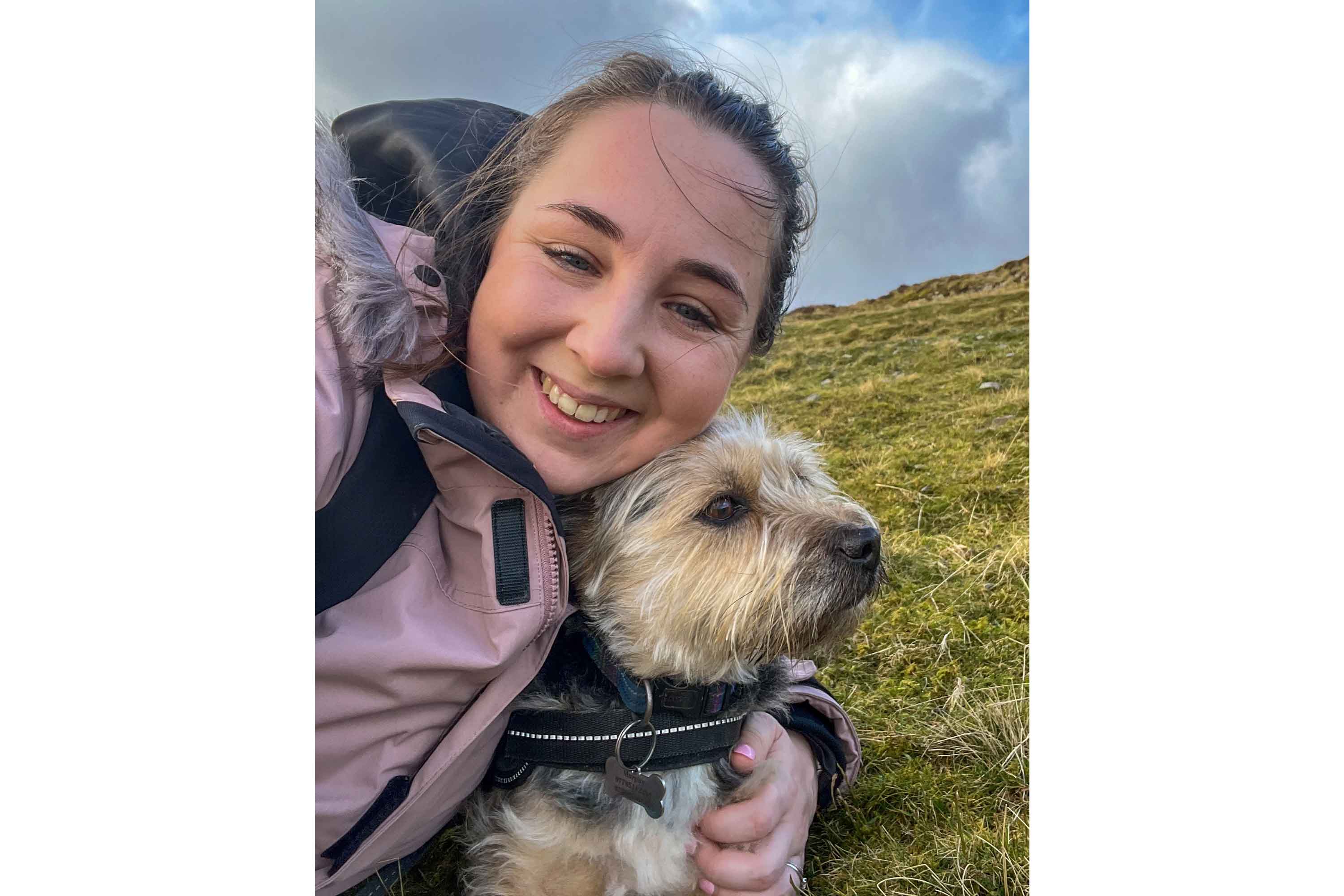 Emily and her dog Murphy taking a selfie on a windswept hill