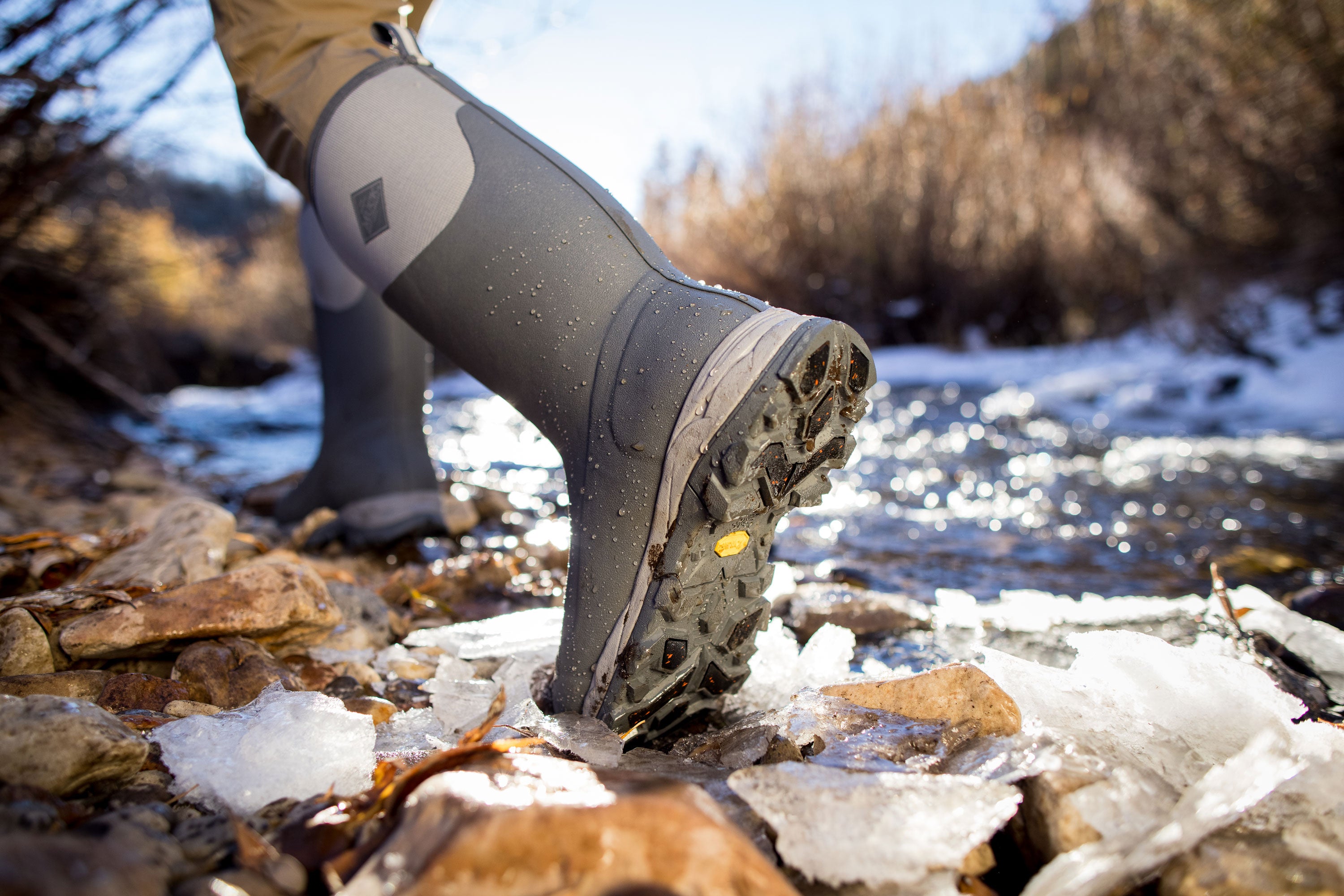 Person walking near an icy river