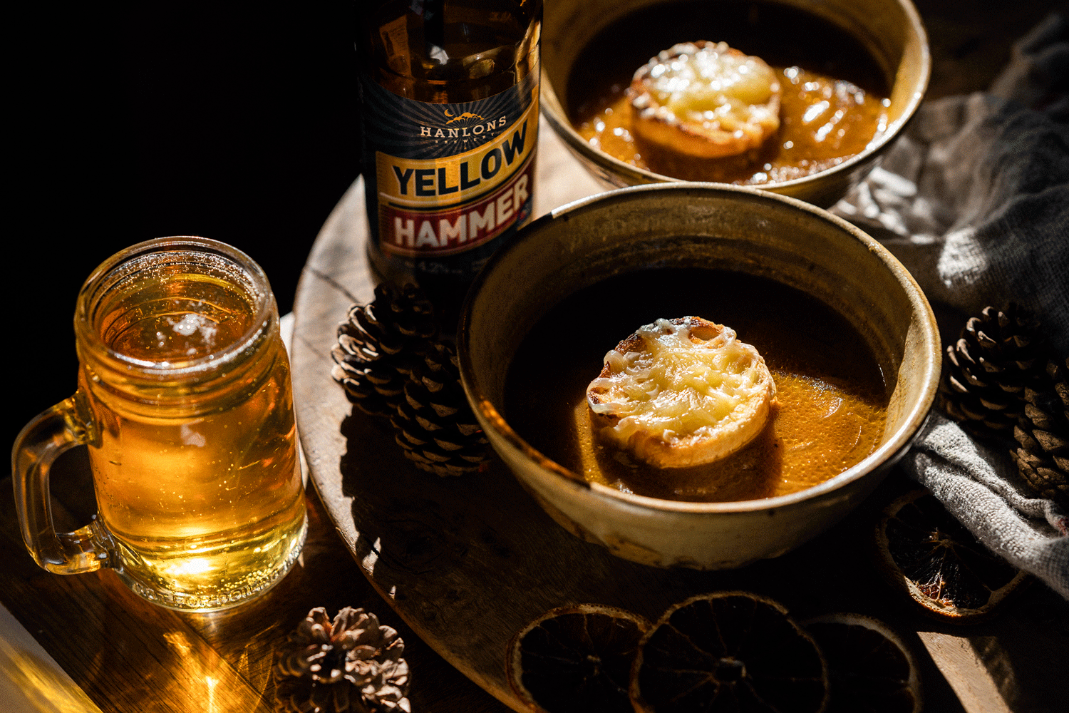 French Onion Soup served in bowls topped with Quicke’s Vintage Cheddar.