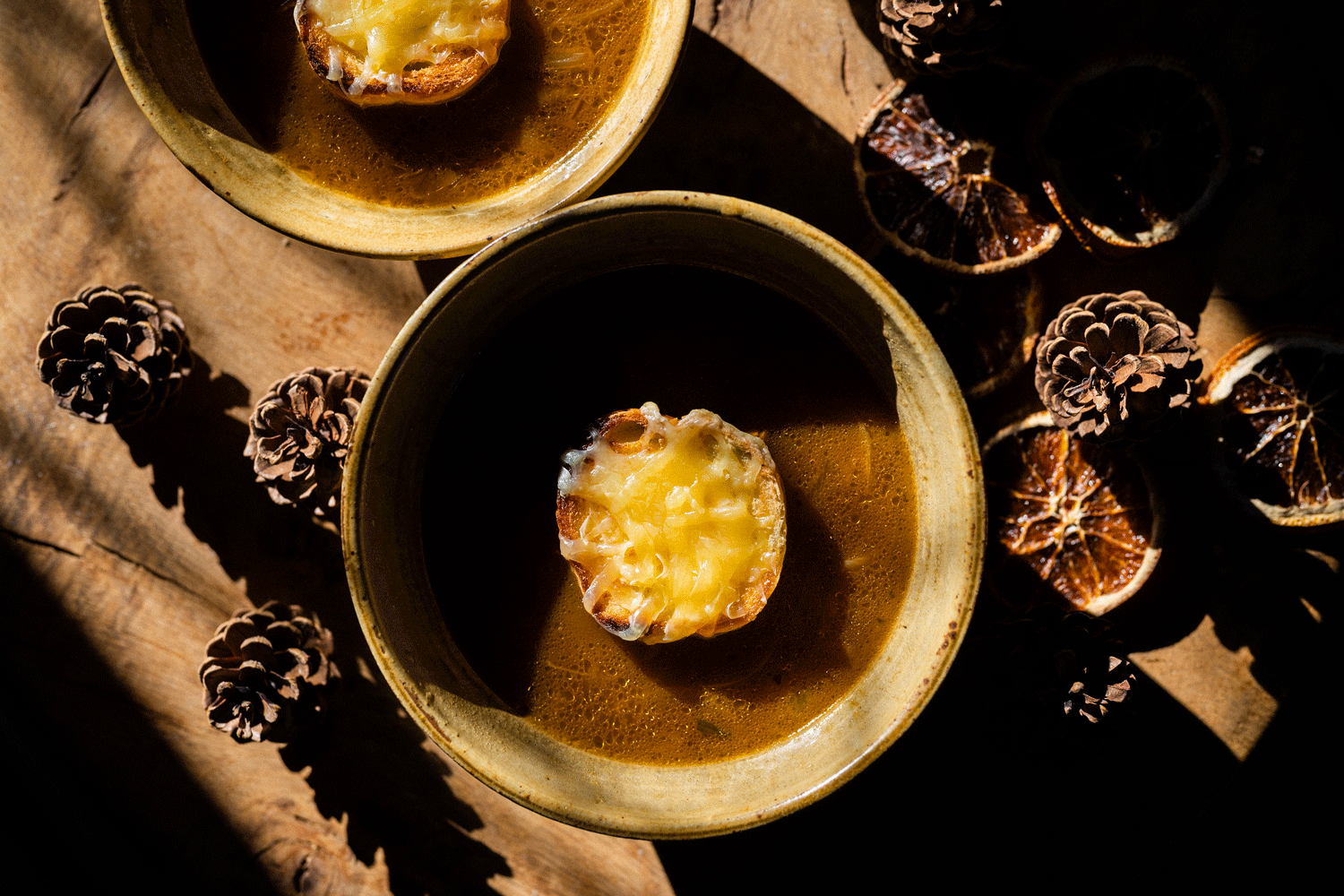 French Onion Soup served in bowls topped with Quicke’s Vintage Cheddar.